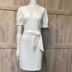 Express fitted mid length dress, front tie, pointed sleeves almost puff sleeve